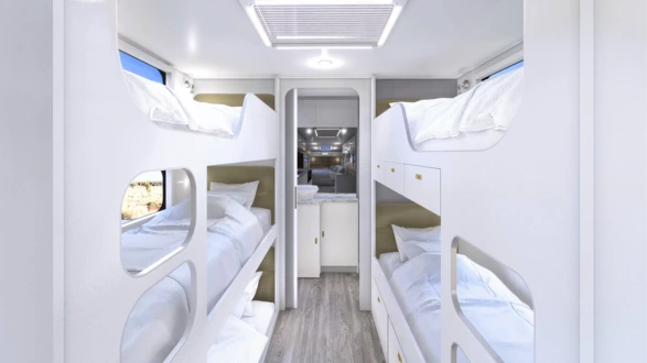 3 bunks on roadsite, 2 with drawers on doorside and rear en-suite