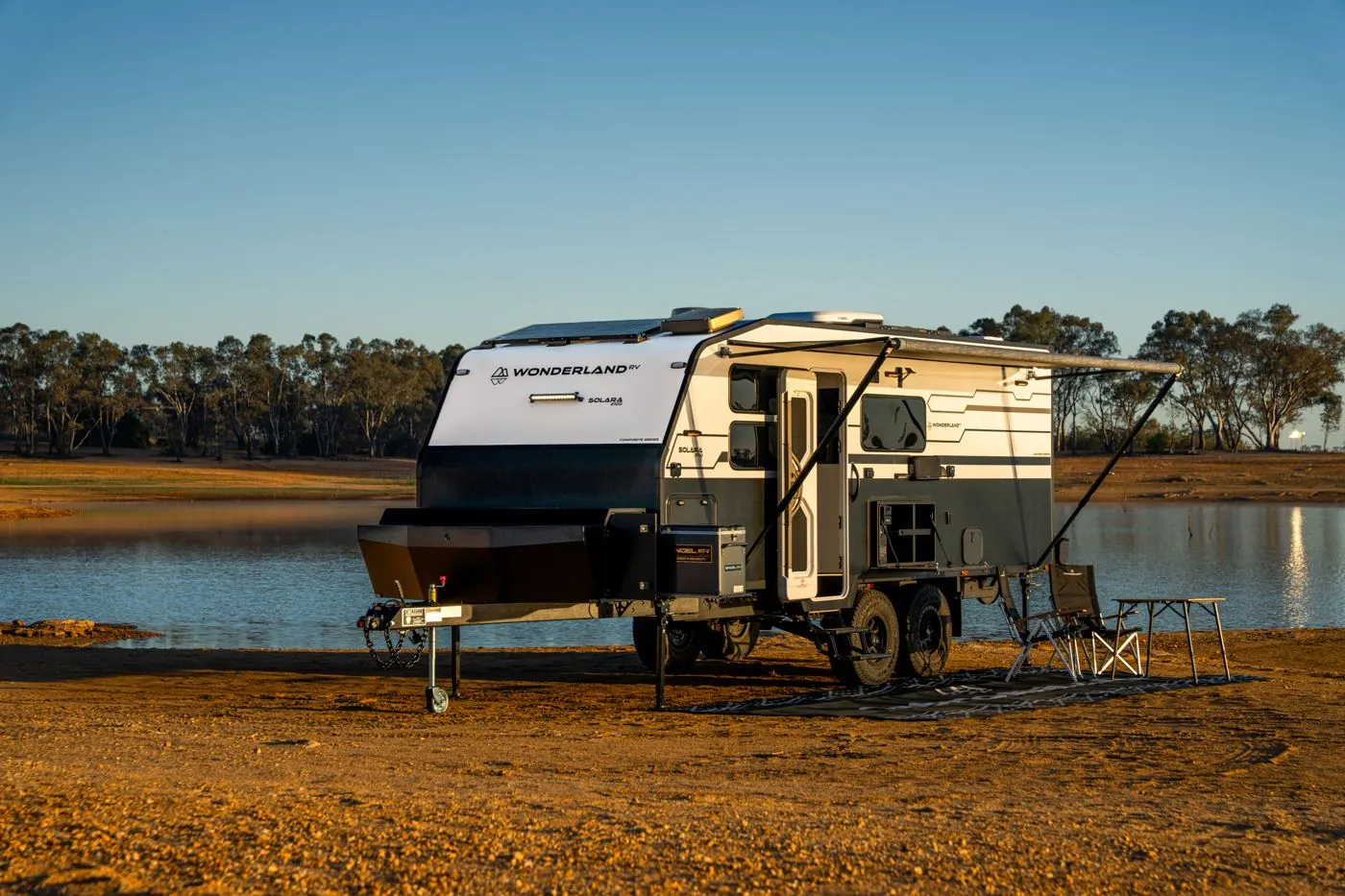 Wonderland RV Solara set up beside a lake