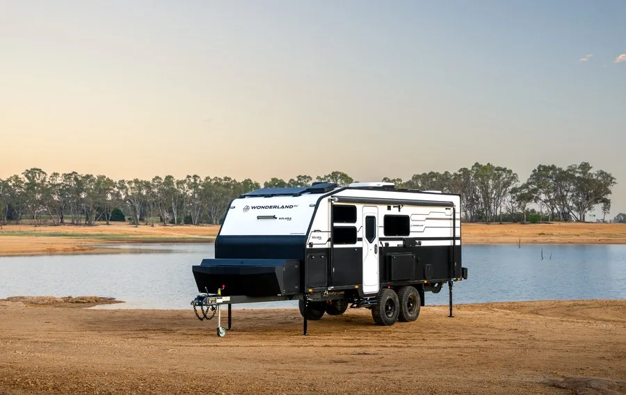 A Wonderland RV Solara 2100 parked beside a lake