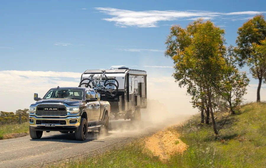A Wonderland RV XTR being towed along a dusty country road