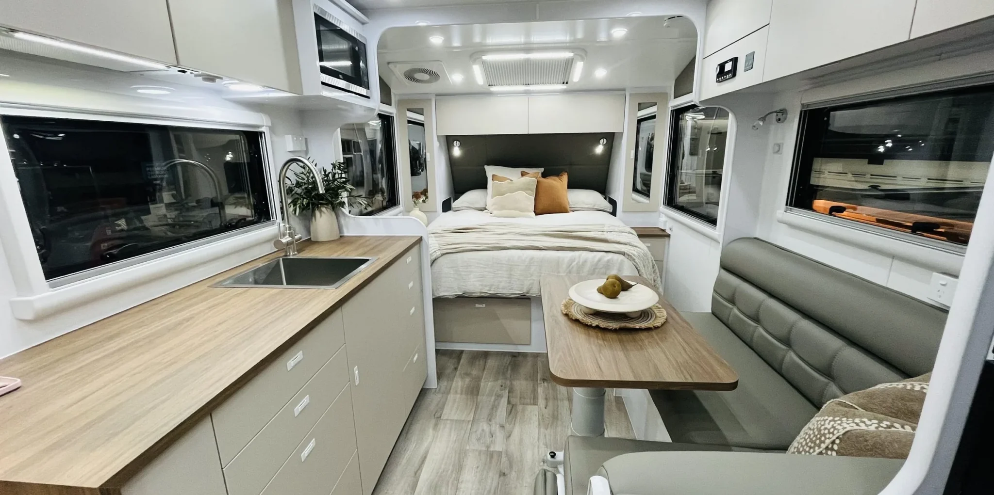 Inside a Wonderland RV: kitchen, dinette and queen bed