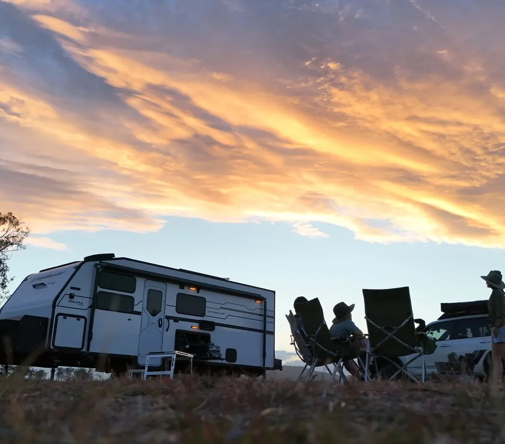 The Feel Good Family&rsquo;s Solara at camp under a sunset sky