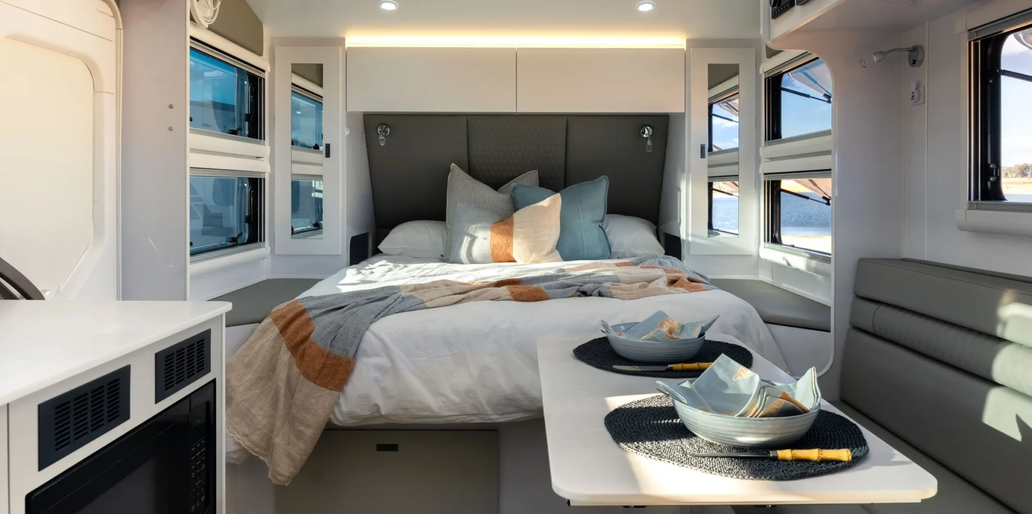 The queen bed at the front of a Wonderland RV