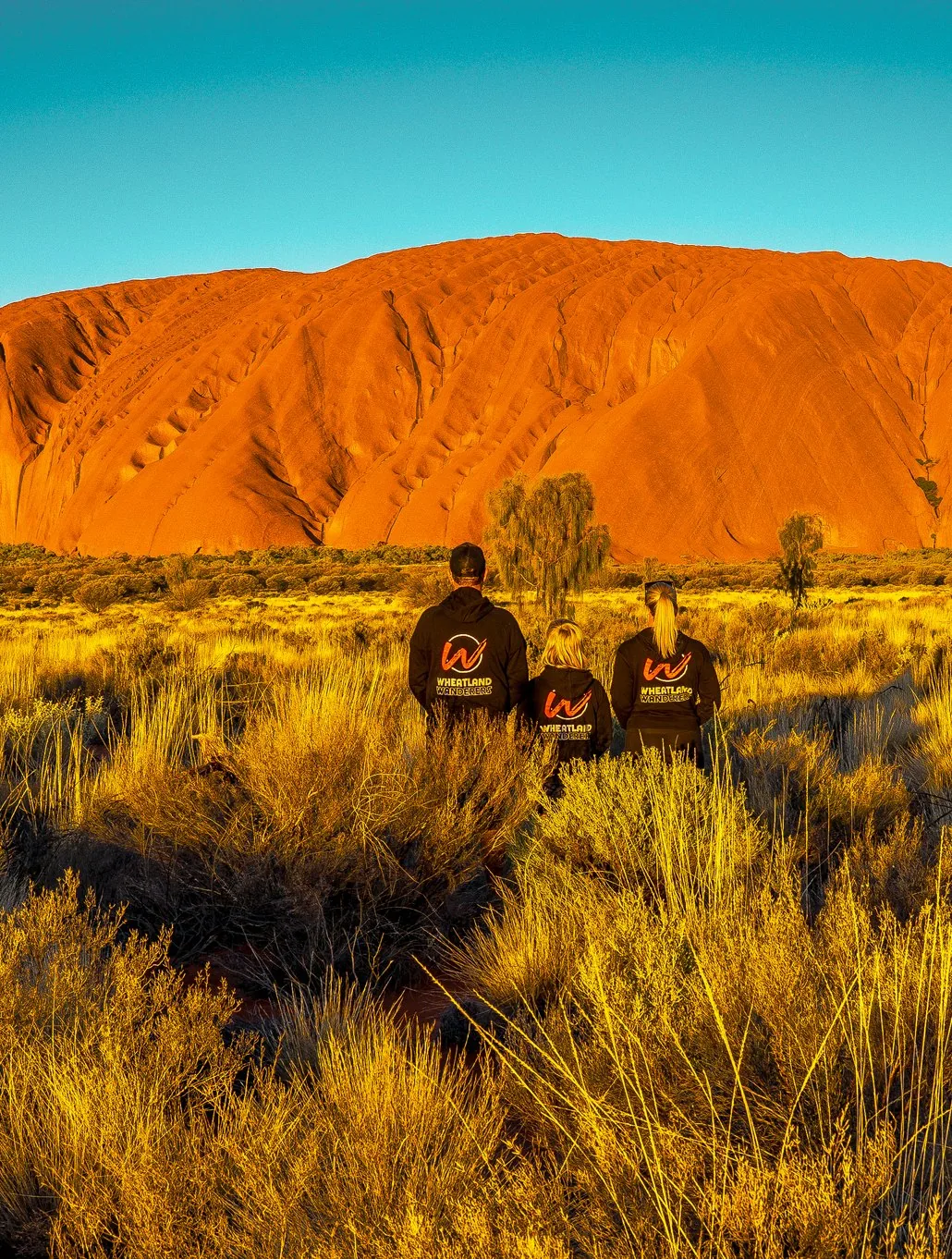 The Wheatland Wanderers in front of Uluru